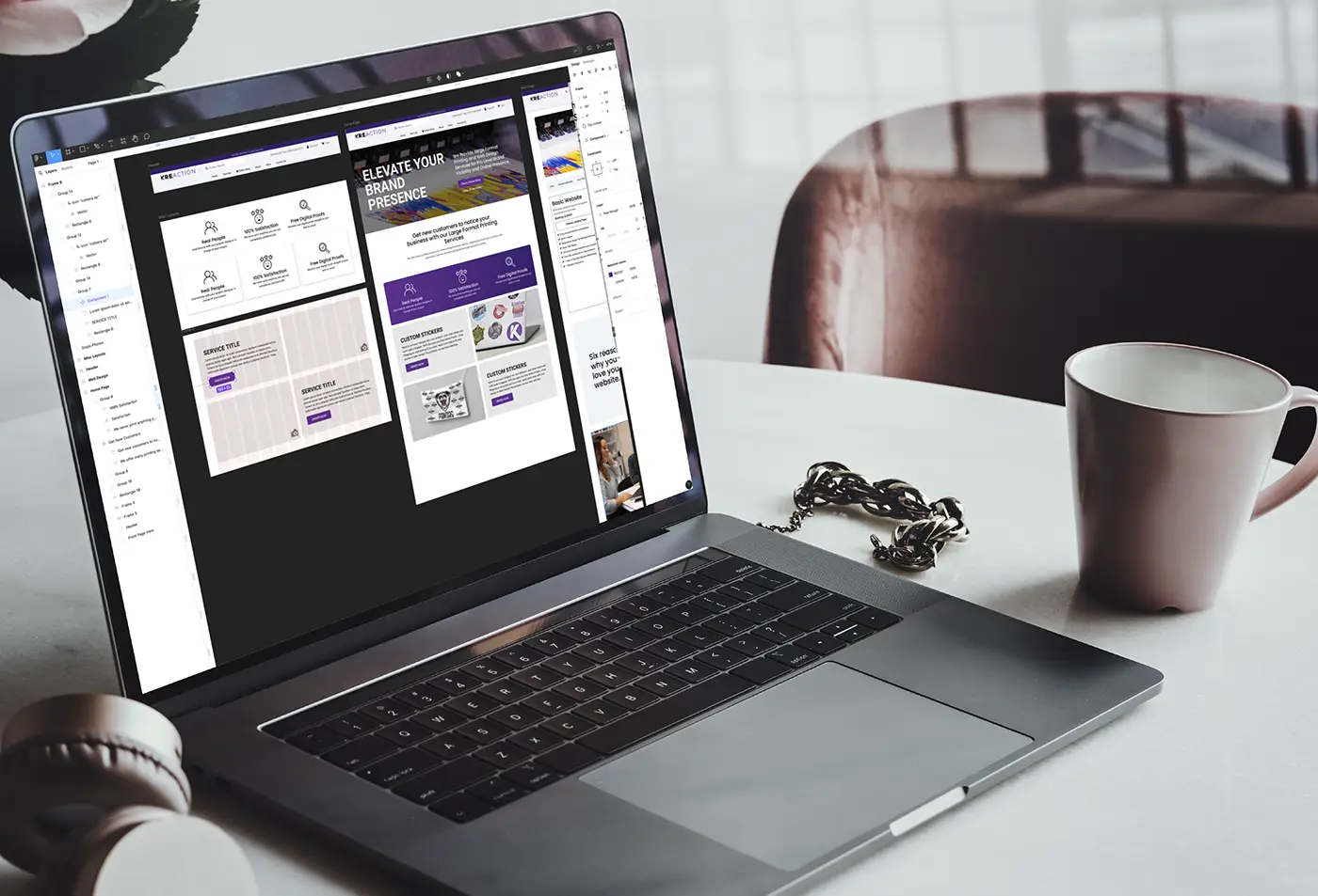 Laptop on a desk showing a website design in progress